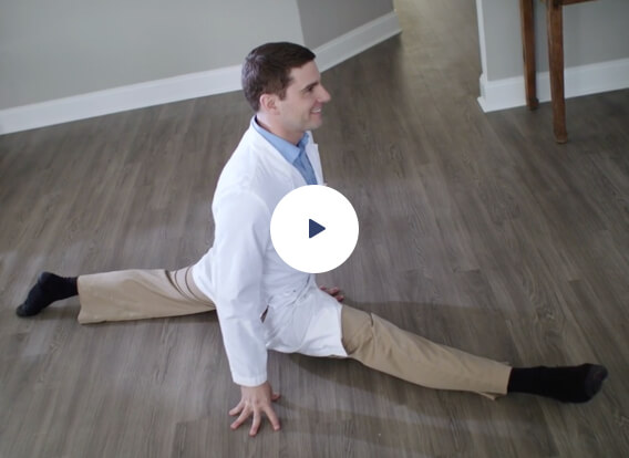 Dentist doing the splits in his office